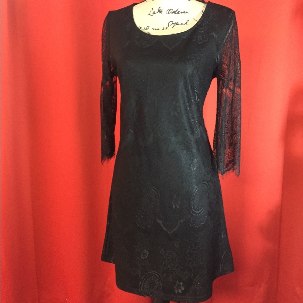 Black lace cocktail dress. Brand solitaire size S